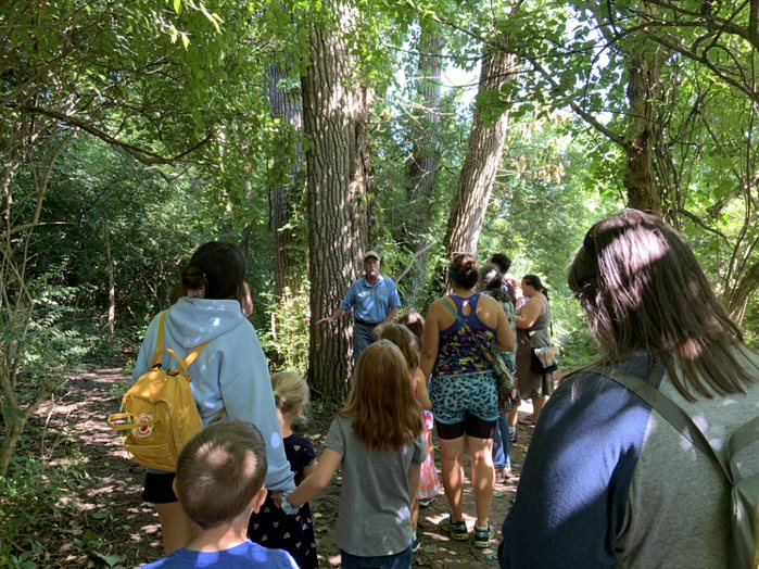 Program participants are lead on a hike by MetroParks naturalist