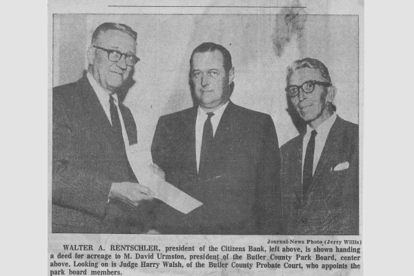 Judge Walsh in the 1950s Three men in suits posing with a check to purchase park property
