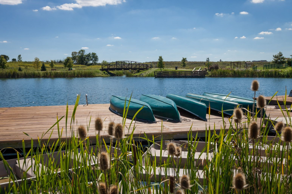 Boats on docks near a lake in Voice of America MetroPark