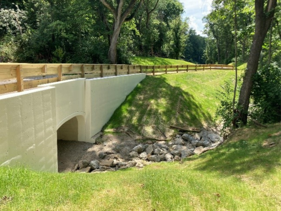 Bike trail crossing a creek at Rentschler Forest MetroPark