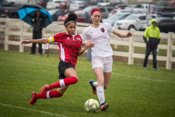 Girls fighting for soccer ball at during a tournament at the VOA Athletic Complex