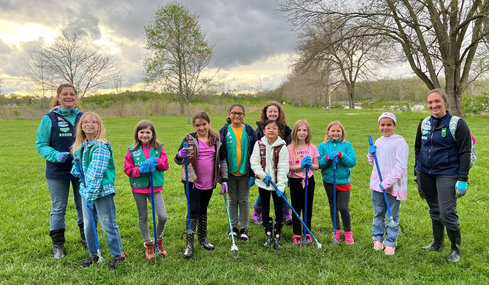 Girl Scouts volunteering at a trash cleanup